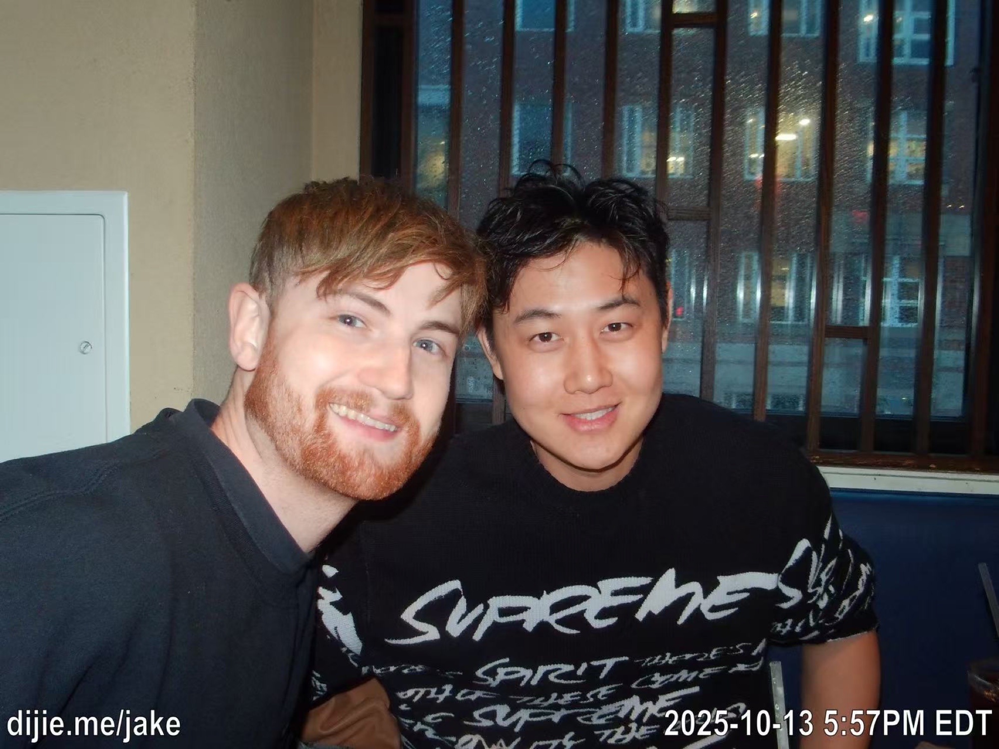 Two friends smiling together at a restaurant